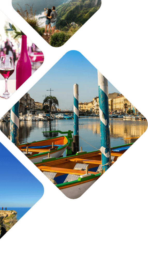 Un couple prenant une photo au bord d'une falaise, une bouteille et un verre de vin rouge, des barques amarées sur le port de Sète